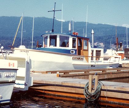 Jolly Roger named Whiskey Jack at anchor